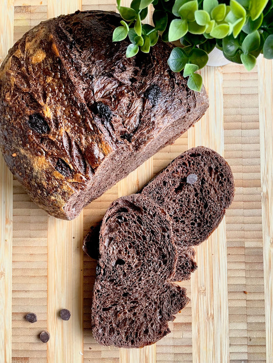 Loaf of double chocolate sourdough bread on a cutting board