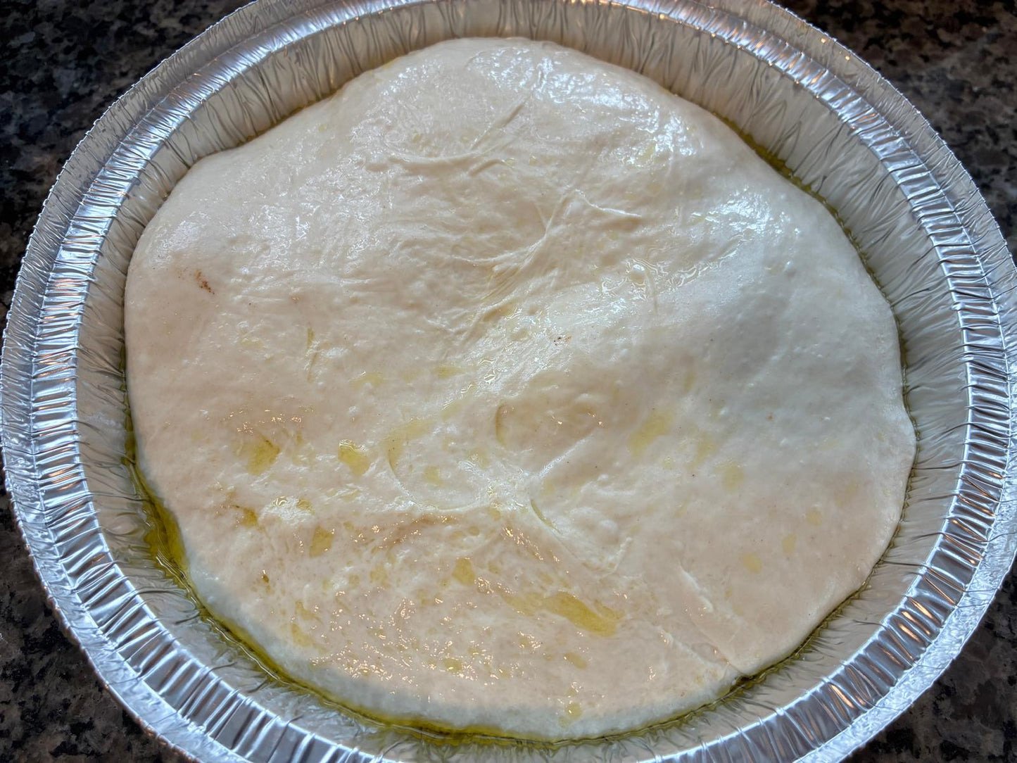 Raw sourdough focaccia dough ready to bake