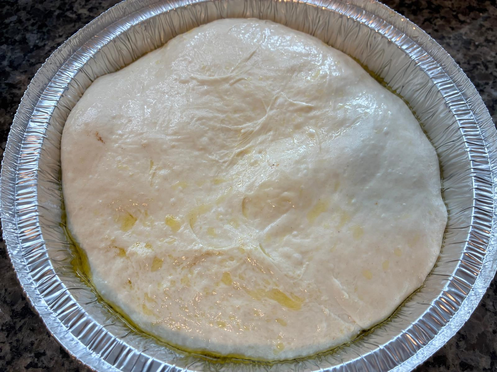 Raw sourdough focaccia dough ready to bake